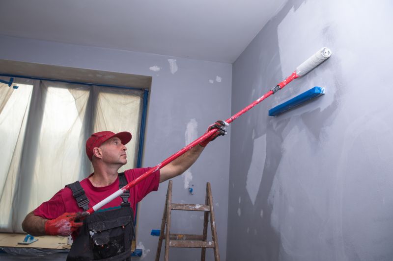 Handyman painting a wall