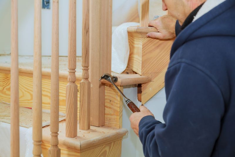 Handyman fixing a staircase railing